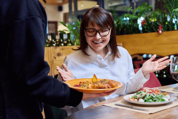 Restaurant staff interacting with customers to enhance service experience